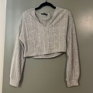 Light grey cropped sweater.